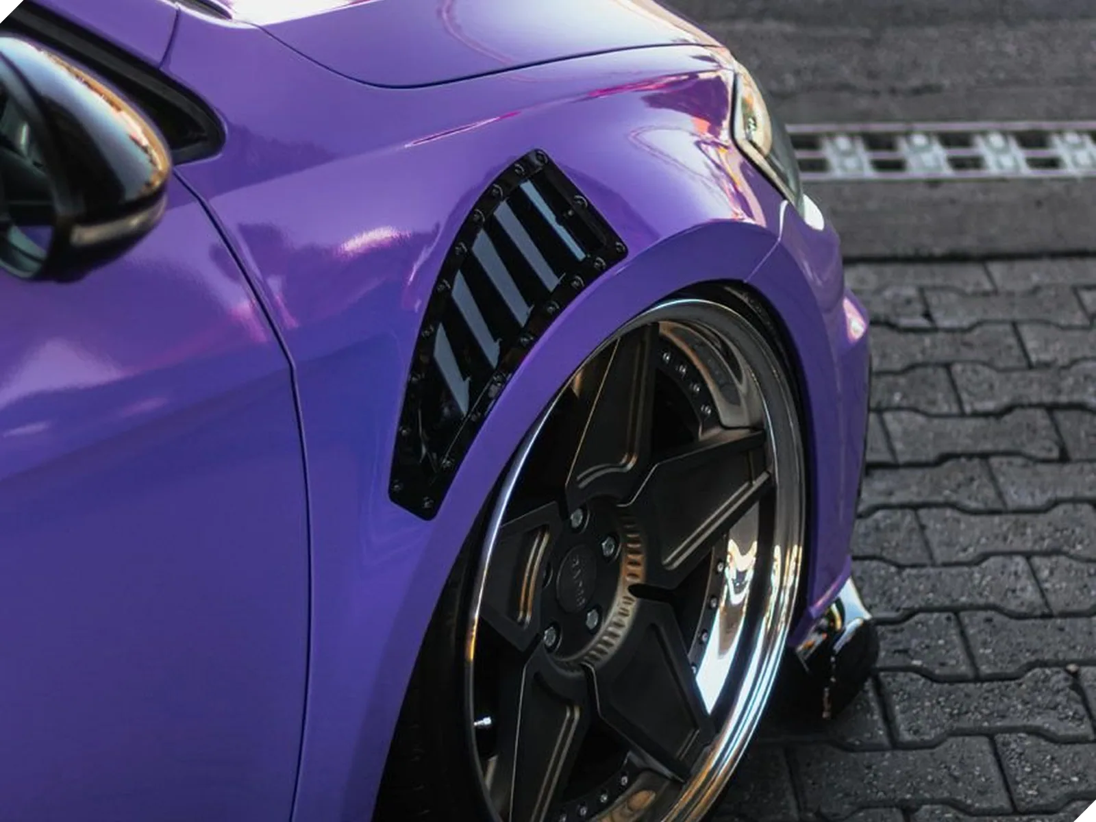 Glossy purple car with a ceramic coating finish